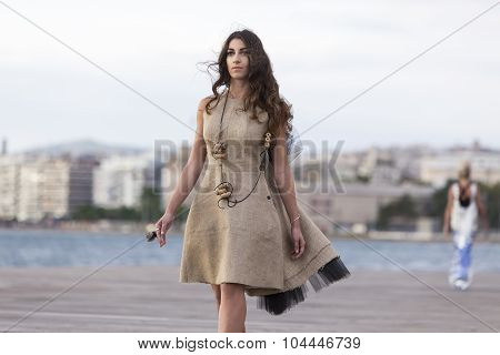 Models Walk An During  Outdoor Fashion Show With Clothing Made Out Of Recycled Materials Was Held In