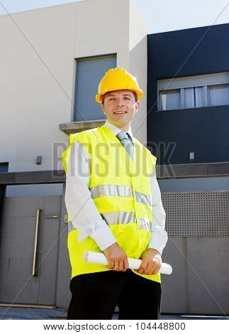 Young Attractive Foreman Worker Supervising Building Blueprints Outdoors Wearing Construction Helmet