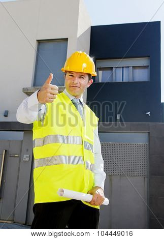 Young Attractive Foreman Worker Supervising Building Blueprints Outdoors Wearing Construction Helmet