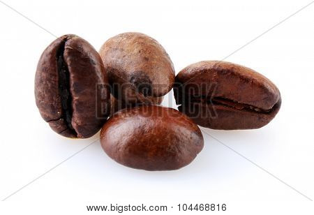 Brown coffee beans isolated on white
