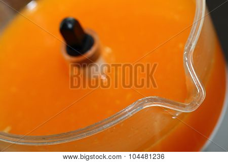 Fresh Orange Juice In Juicer Machine With Hand