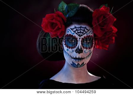 Woman in Halloween makeup - mexican Santa Muerte mask.