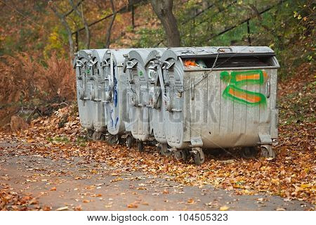 Dumpsters by the walking path