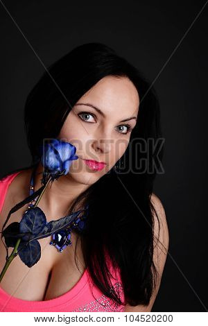 sexy woman with a blue rose