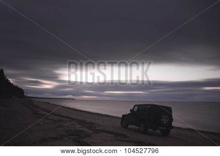 Gulf of Finland, Russia OCTOBER 05, 2015: photos of jeep Wrangler on the beach of the Gulf of Finlan