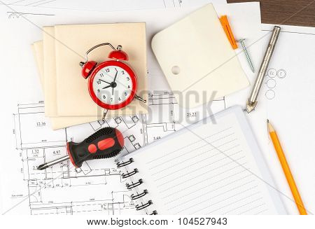 Copy book with tiles and alarm clock
