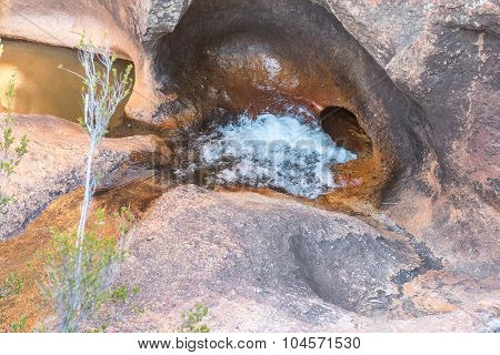River Disappears Through Hole