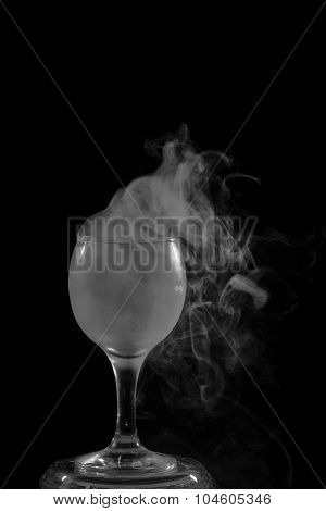 Smoke Shisha In Cocktail Glass On A Black Background.
