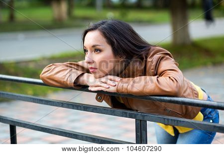 Portrait Of A Young Beautiful Girl In The Urban Landscape.