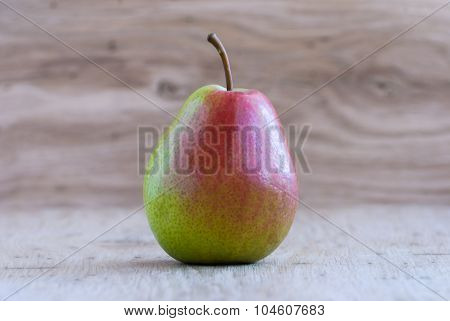 Pear On A Wooden Table, Closeup