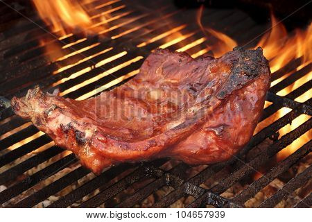 Baby Back Or Pork Spareribs On The Hot Flaming Grill