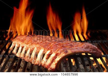 Baby Back Or Pork Spareribs On The Hot Flaming Grill