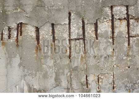 Fragment Of A Concrete Wall With A Rusty Wire Mesh
