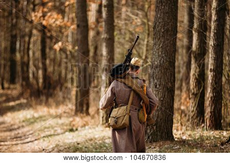 Unidentified re-enactor dressed as Soviet soldier machine gunner