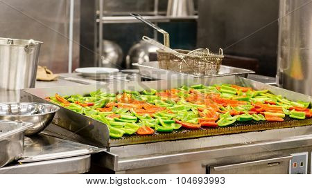 Red And Green Peppers On A Grill