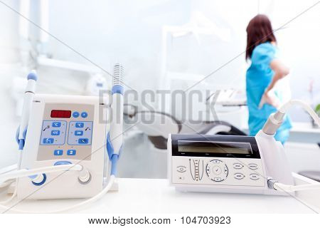 Equipment and dental instruments in dentist's office. Dentist at work, tools close-up. Dentistry