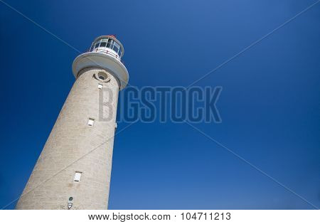 Lighthouse against clear blue sky