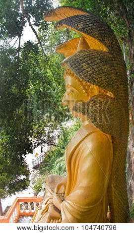 Big Buddha With A Naga Over His Head In Thai Temple