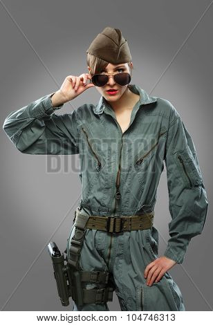 Sexy Girl Dressed As A Helicopter Pilot Posing In Sunglasses