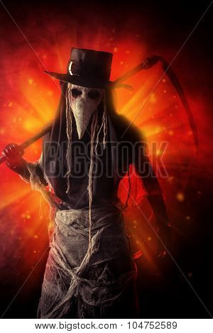 Portrait of a terrible plague doctor with a scythe. Medieval Europe. Halloween.