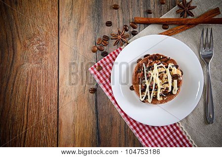 Chocolate Nut Cake on Vintage Retro Woody Background