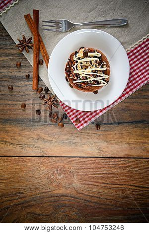 Chocolate Nut Cake on Vintage Retro Woody Background