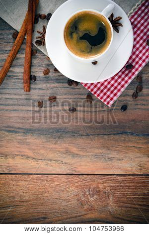 Cup of Coffee on Woody Background in Retro Vintage Style