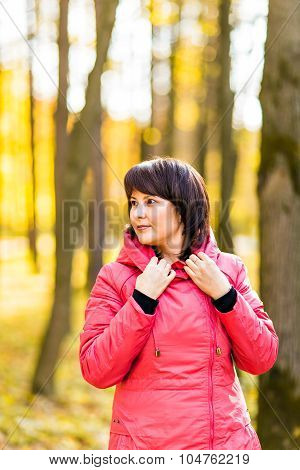Beautiful woman in autumn park