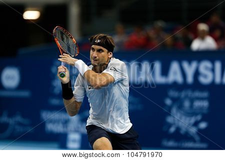 KUALA LUMPUR, MALAYSIA - OCTOBER 02, 2015: Spain's David Ferrer hits a backhand return in his match at the Malaysian Open 2015 tennis tournament held at the Putra Stadium, Malaysia.