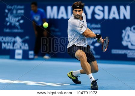KUALA LUMPUR, MALAYSIA - OCTOBER 02, 2015: Spain's David Ferrer hits a backhand return in his match at the Malaysian Open 2015 tennis tournament held at the Putra Stadium, Malaysia.