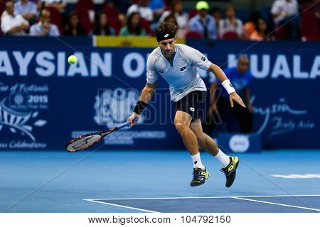 KUALA LUMPUR, MALAYSIA - OCTOBER 02, 2015: Spain's David Ferrer prepares to play a forehand return in his match at the Malaysian Open 2015 tennis tournament held at the Putra Stadium, Malaysia.