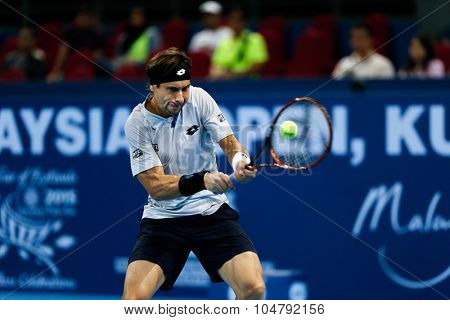 KUALA LUMPUR, MALAYSIA - OCTOBER 02, 2015: Spain's David Ferrer hits a backhand return in his match at the Malaysian Open 2015 tennis tournament held at the Putra Stadium, Malaysia.