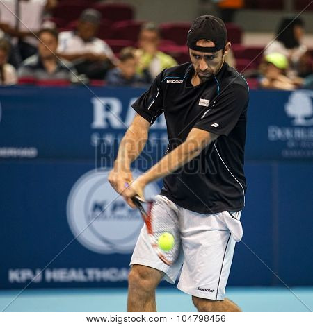 KUALA LUMPUR, MALAYSIA - OCTOBER 03, 2015: Germany's tennis player Benjamin Becker plays a backhand return at the 2015 Malaysian Open tennis tournament from Sep 26 - Oct 4, 2015 in Stadium Putra.