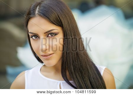 Oriental style. Sensual arabic woman model. Beautiful clean skin, saturated makeup. Bright eye make-up and dark eyeliner