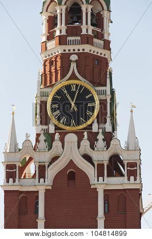 Kremlin Spasskaya tower clock over blue sky