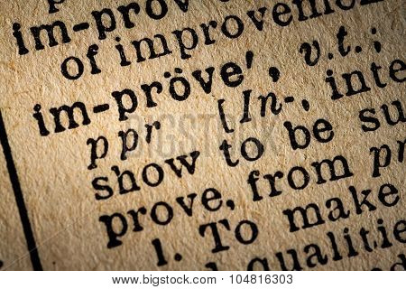 Close-up Of The Word Improve And Its Definition