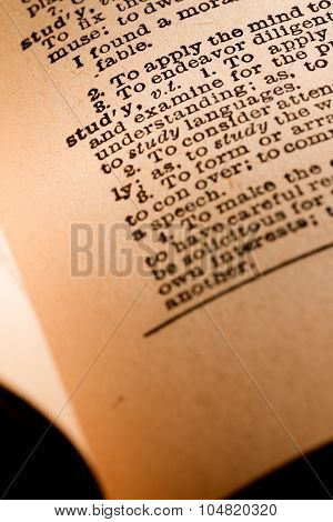 Close-up Of An Opened Dictionary Showing The Word Study