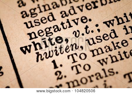 Close-up Of An Opened Dictionary Showing The Word White