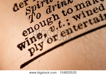 Close-up Of An Opened Dictionary Showing The Word Wine