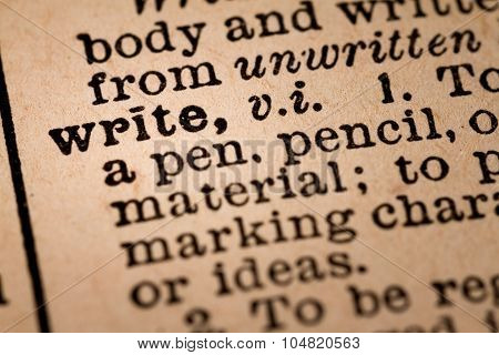 Close-up Of An Opened Dictionary Showing The Word Write