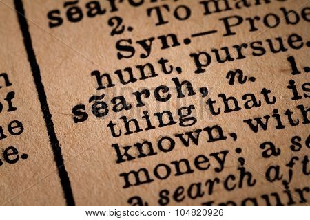 Close-up Of An Opened Dictionary Showing The Word Search