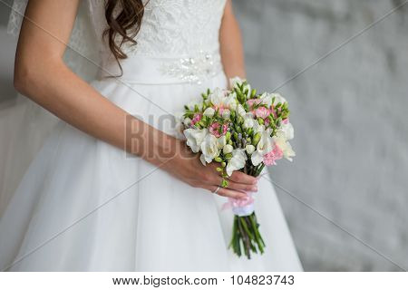 Bouquet Of Flowers In The Hands Of Women