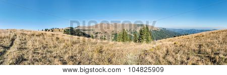 Panorama Of Mountains Ridge Under Blue Sky In Late Summer