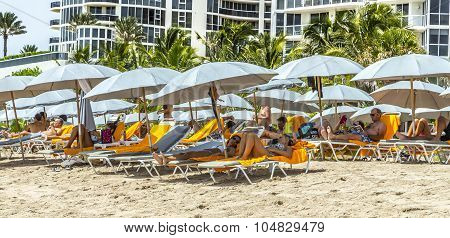 People Relax At Jade Beach In Sunny Isles Beach
