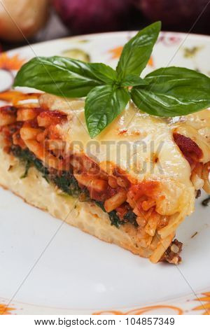 Pasticcio or pastitsio with chard and tomato sauce, italian baked pasta