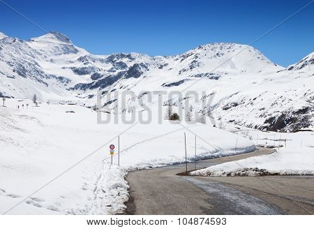 Mountain road in a sunny day (Swiss alps). Simplon Pass, Valais, Switzerland