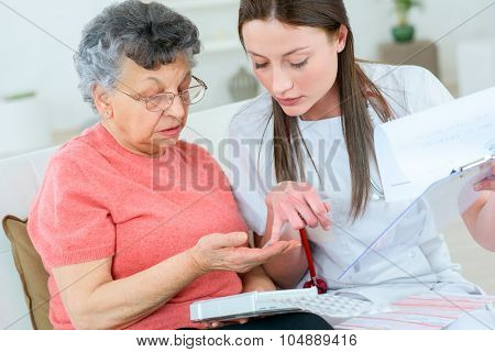Doctor helping patient with medication