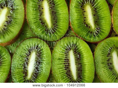 sliced kiwi green background