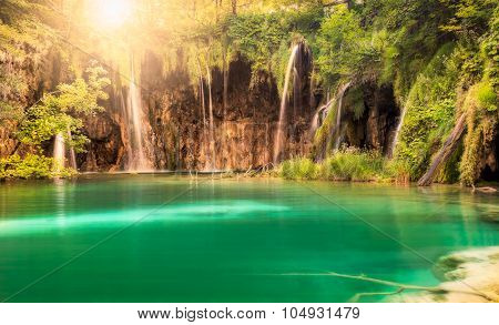 Waterfall with sun at Plitvice Lakes National Park, Croatia