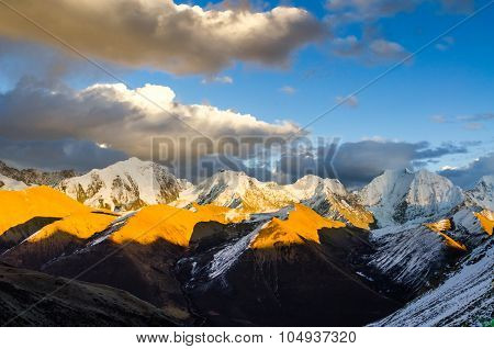 View From St. Moritz In Switzerland: High Snow And Ice Capped Alpine Mountain Range With Red Illumin